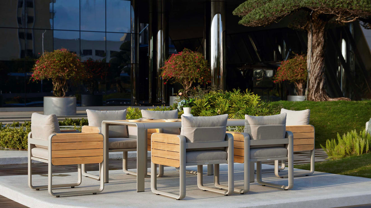 Talia aluminum and teak dining set with flip-up side tablets – shown outdoors (4)