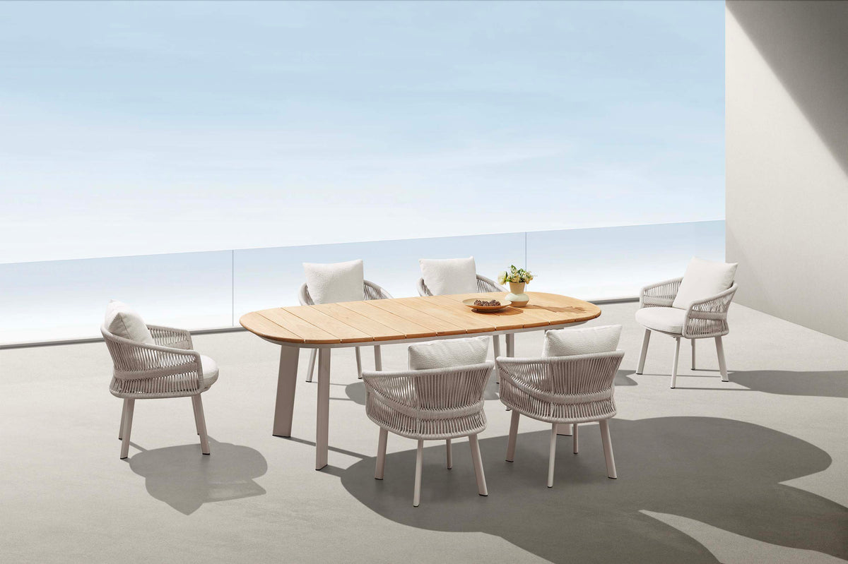 Laska beige aluminum and teak dining armchair – shown outdoors (5)