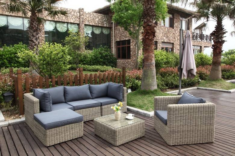 Liberty round resin wicker outdoor ottoman – shown outdoors (3)