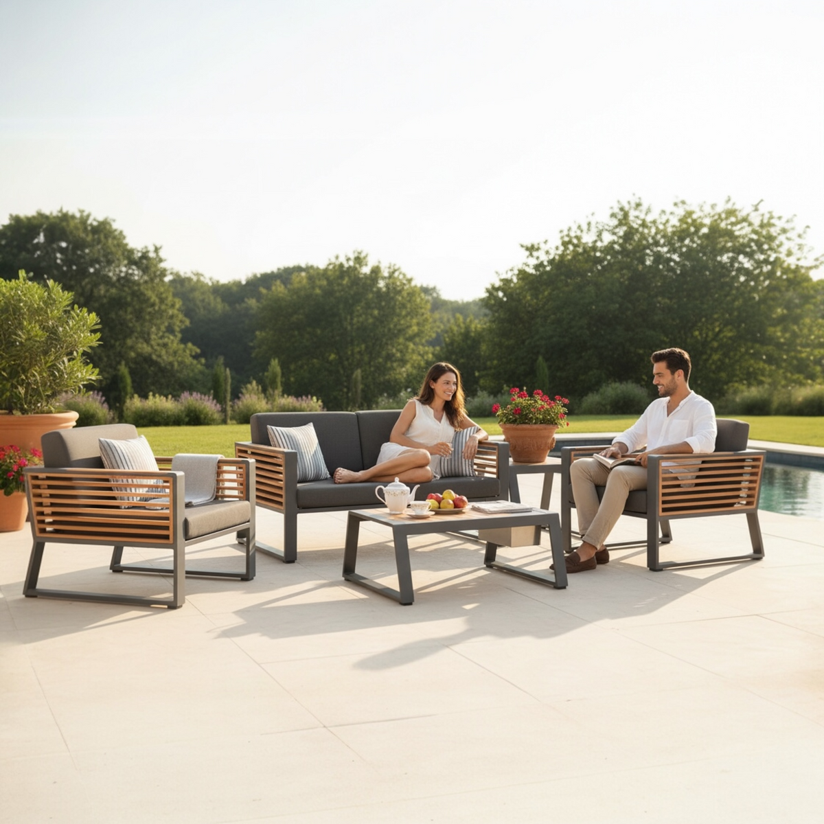 Cofy Mini black aluminum loveseat patio set with teak cooler coffee table – shown outdoors (3)