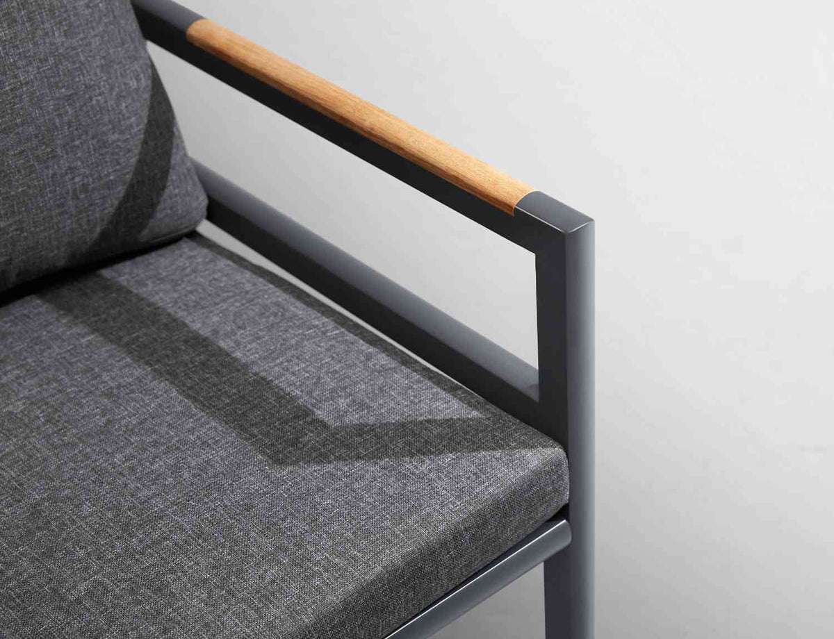 Armchair from the Gloria 6-seat black aluminum and teak slat dining set – close-up detail