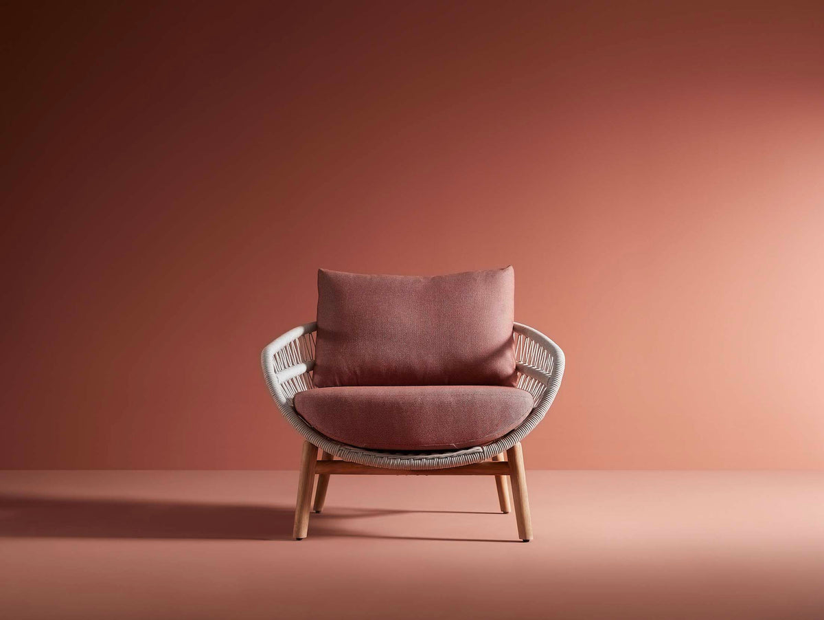 Armchair from the Rose teak and rope patio set with powder pink cushions