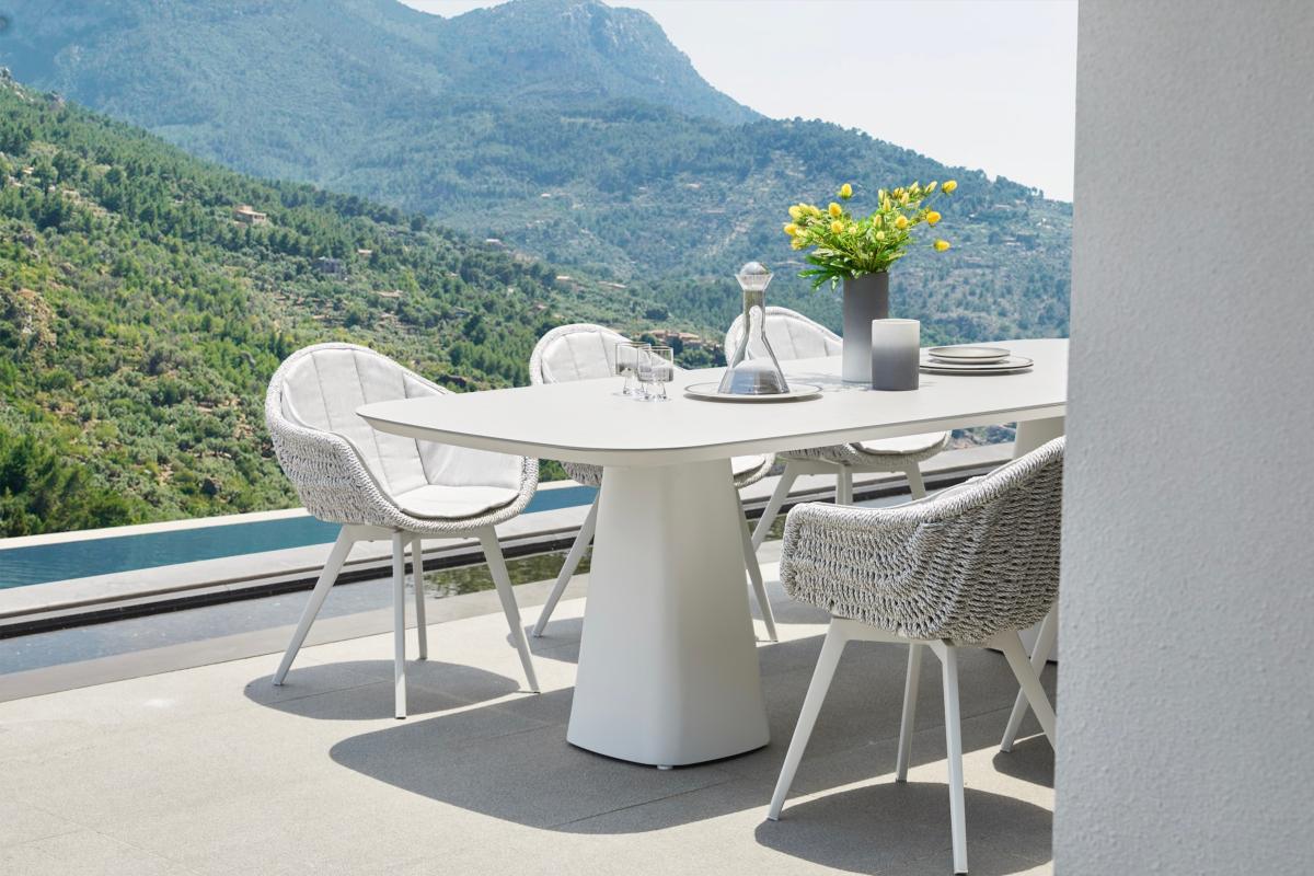 Milo white resin wicker dining armchairs, set of 2 – shown outdoors (4)