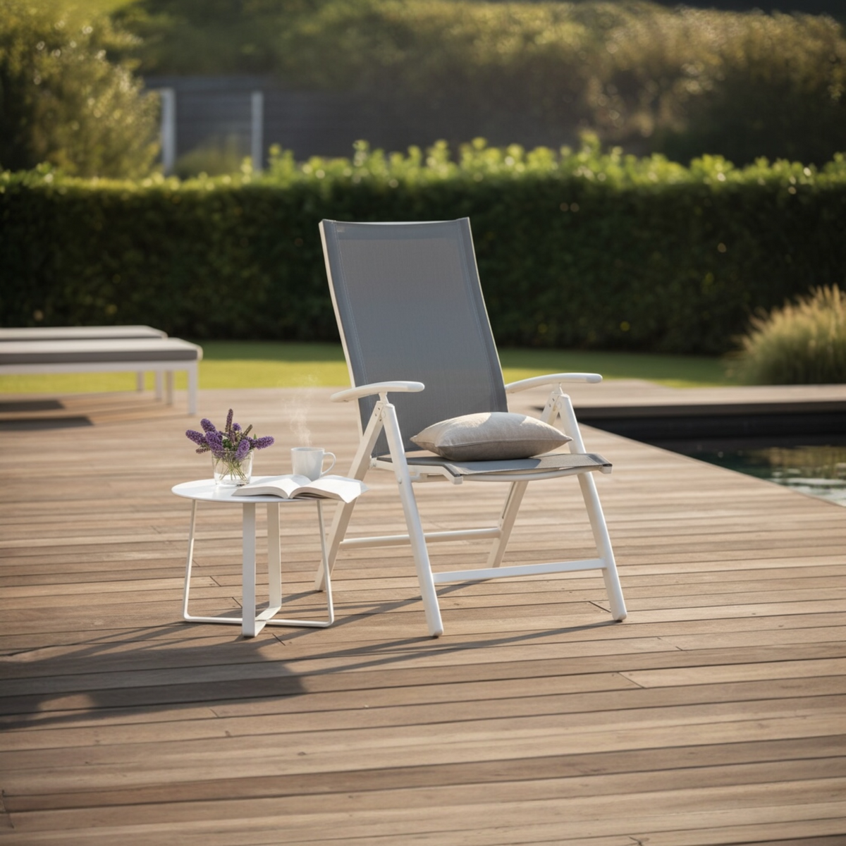 Piky white aluminum patio lounge chair – shown outdoors