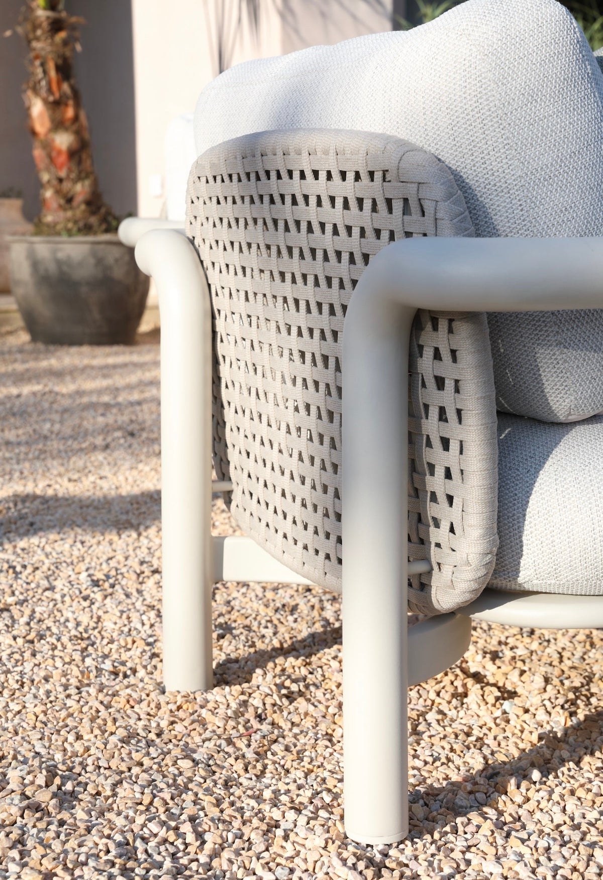 Armchair from the Amaia aluminum and rope patio set with cylindrical sofa and ceramic table – close-up detail