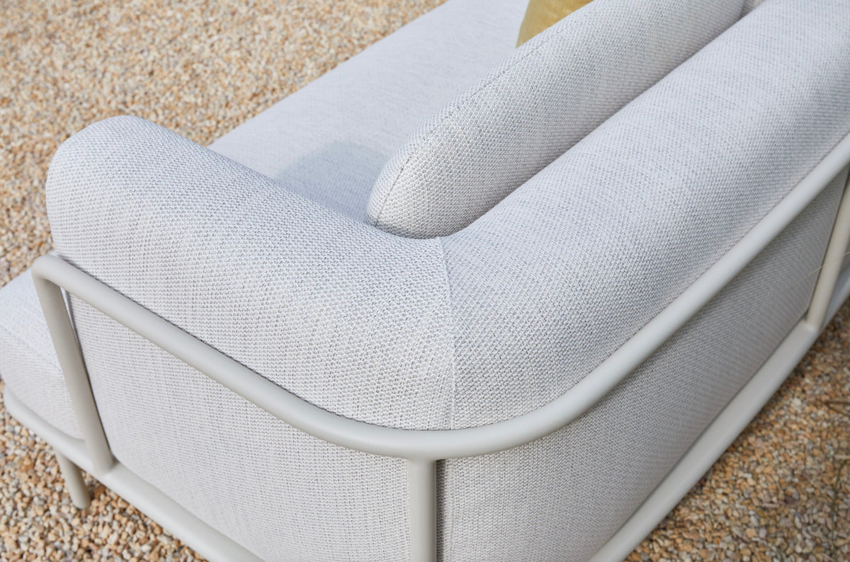 Chaise from the Flora white aluminum outdoor sectional with light gray cushions – close-up detail (3)