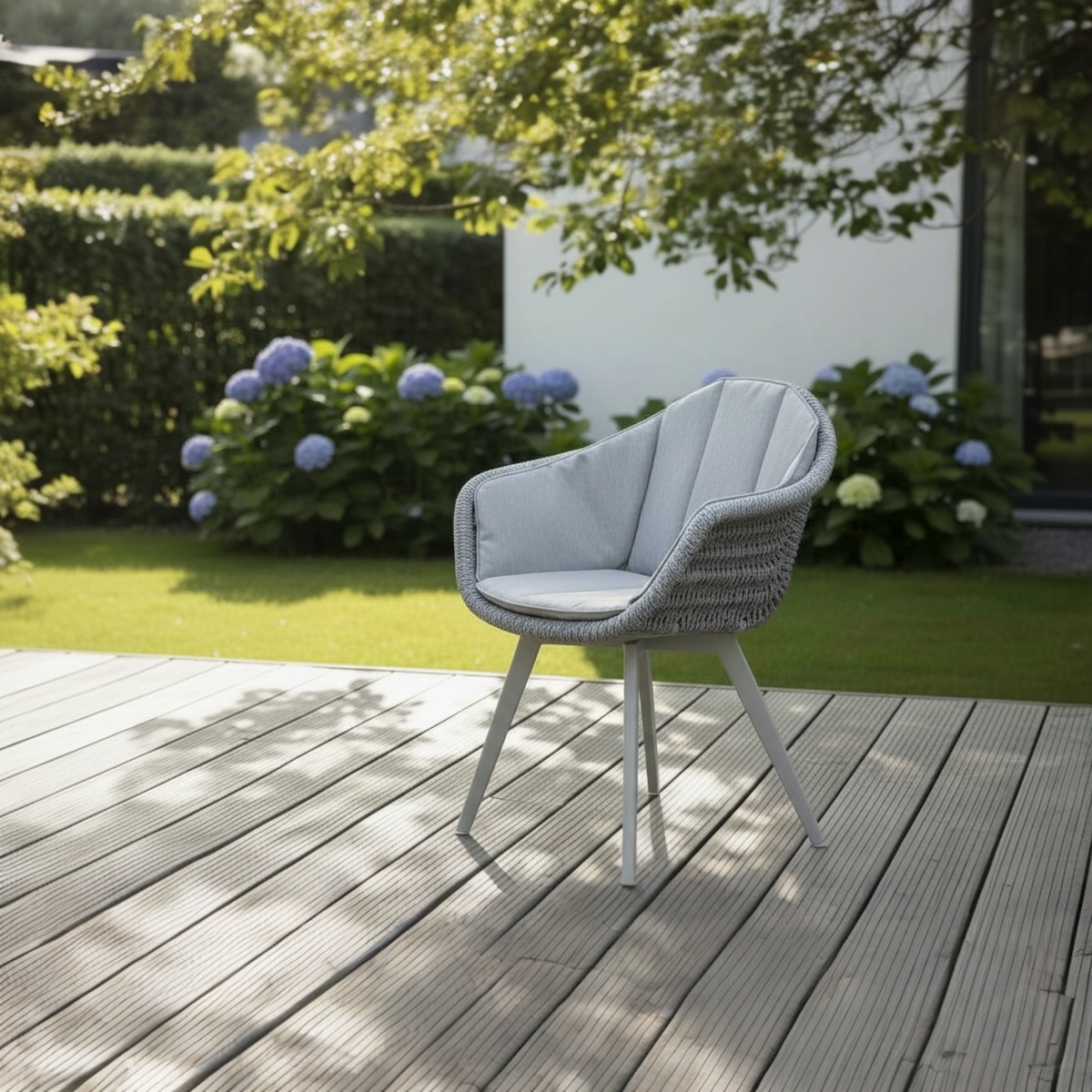 Milo gray resin wicker dining armchairs, set of 2 – shown outdoors