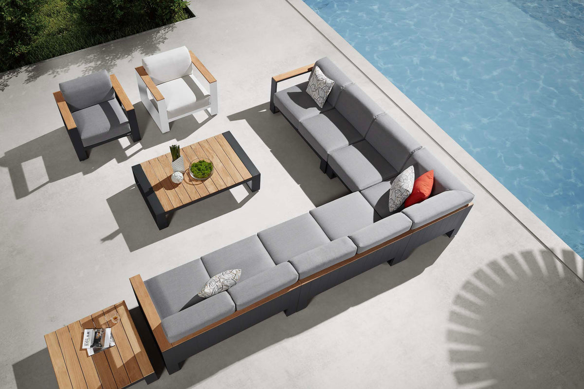Sofy aluminum and teak armless chair module – shown outdoors