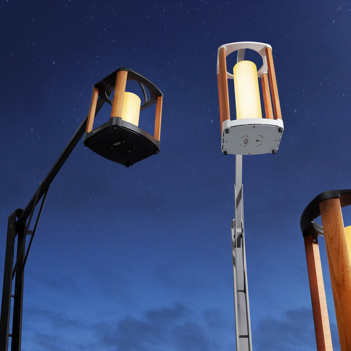 Aurora black solar outdoor lantern, small – shown lit outdoors (2)