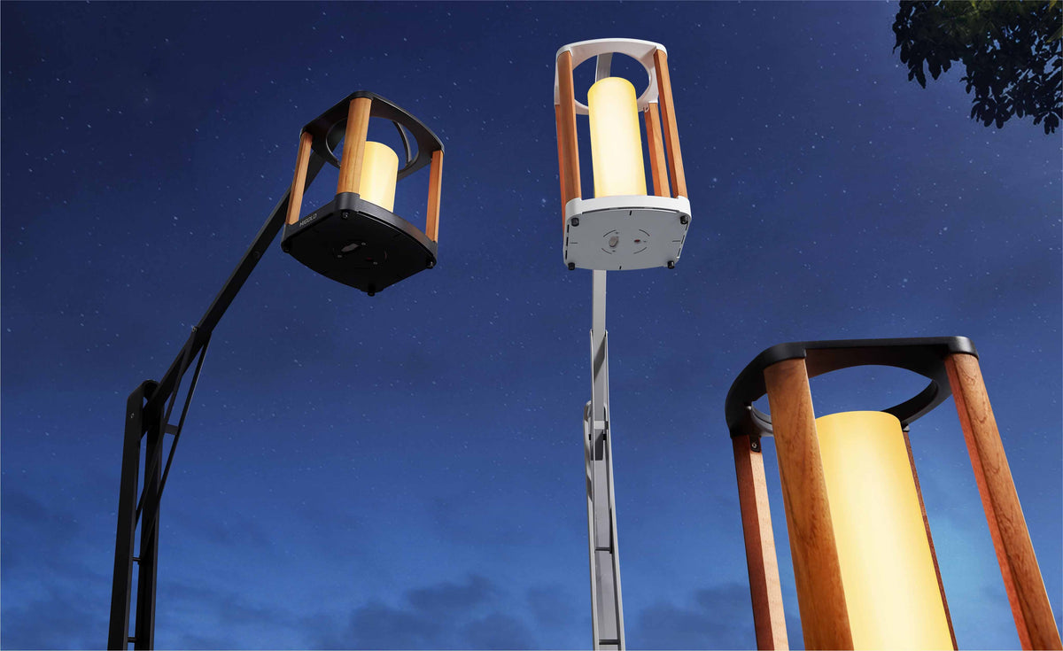 Aurora white solar outdoor lantern, medium – shown lit outdoors (2)