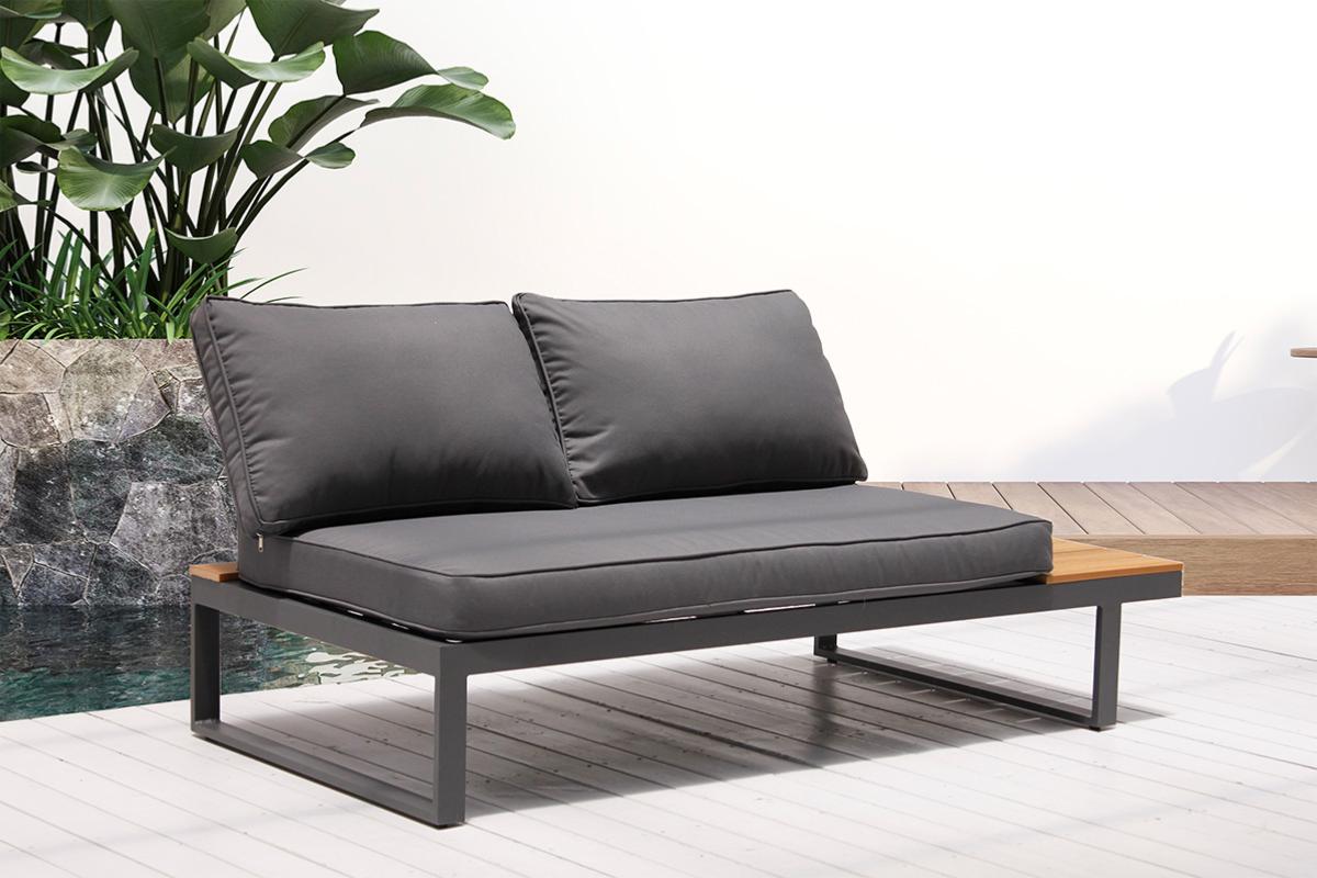 Chaise from the Stacy anthracite aluminum corner patio set with wood-look table – shown outdoors