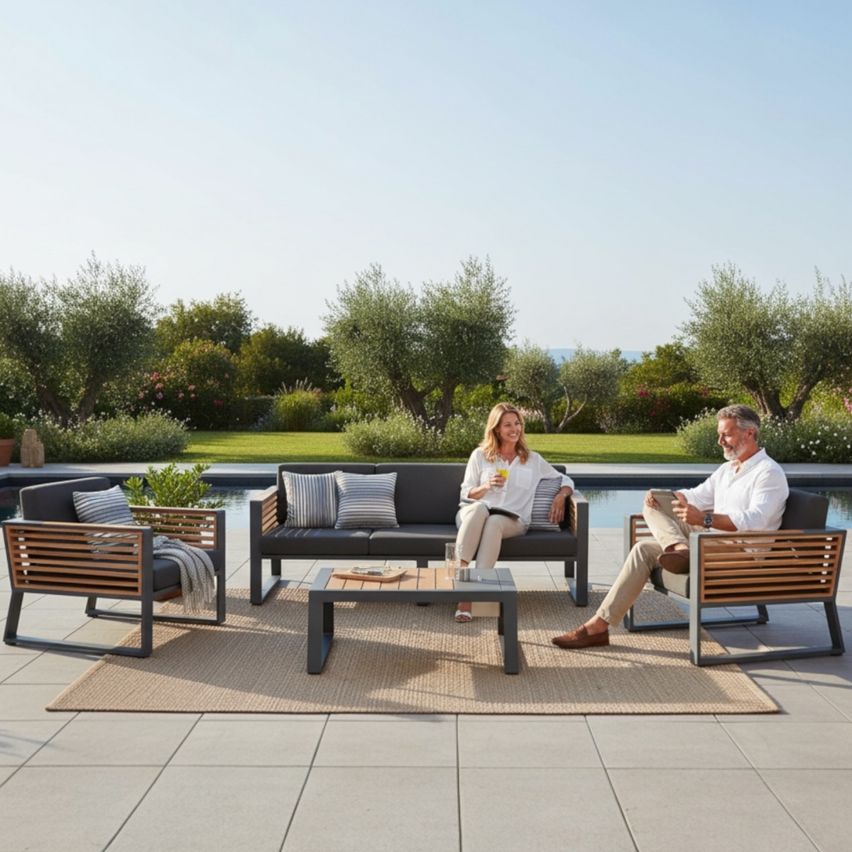 Cofy Bis aluminum patio set with teak and aluminum coffee table with drink cooler – shown outdoors (3)