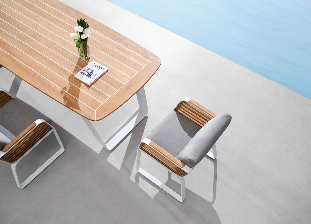 Aily aluminum and teak outdoor dining set with six armchairs – shown outdoors (7)