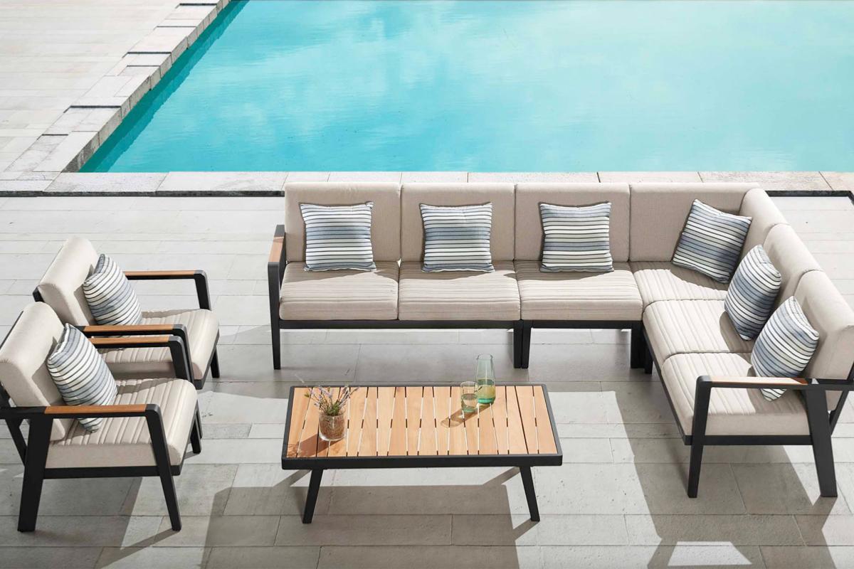 Lovy aluminum and teak outdoor coffee table – shown outdoors