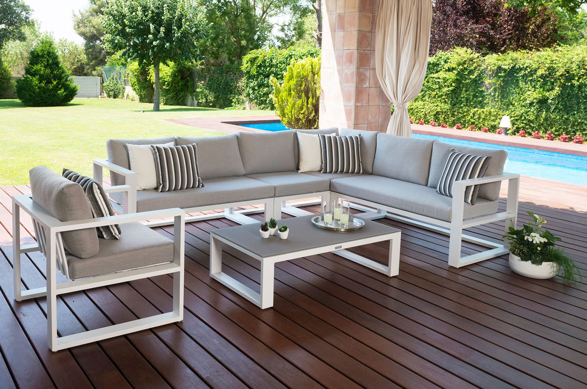 Belly white aluminum outdoor sectional with armchair and tinted glass table – shown outdoors (3)