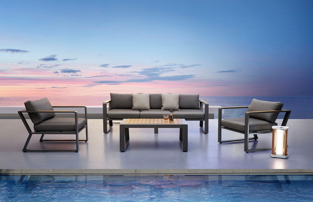 Exy anthracite aluminum and teak 5-seat patio set with teak coffee table – shown outdoors (4)