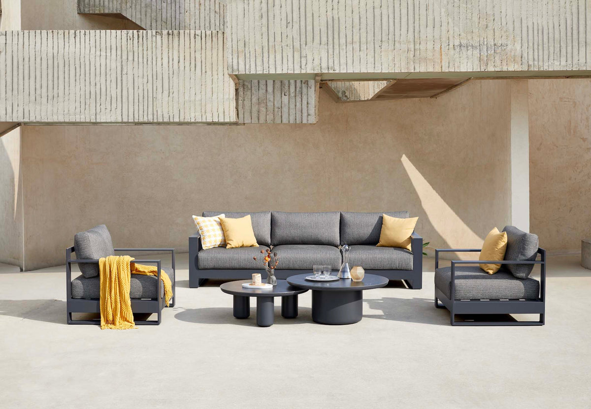 Iris Bis black modular aluminum patio set with gray cushions and ceramic tables – shown outdoors (4)