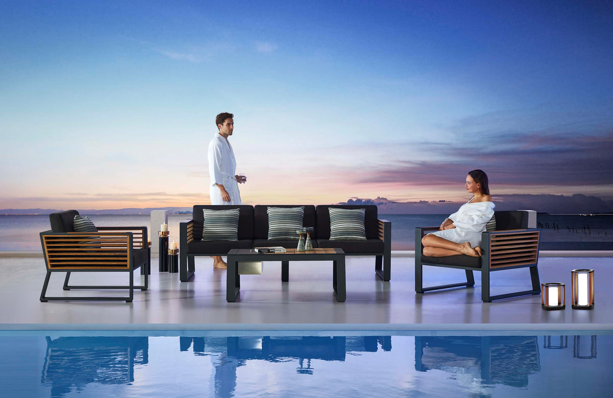Cofy Bis aluminum patio set with teak and aluminum coffee table with drink cooler – shown outdoors (4)