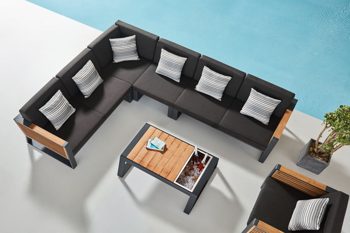 Cofy aluminum and teak outdoor sectional with drink cooler coffee table – shown outdoors (4)