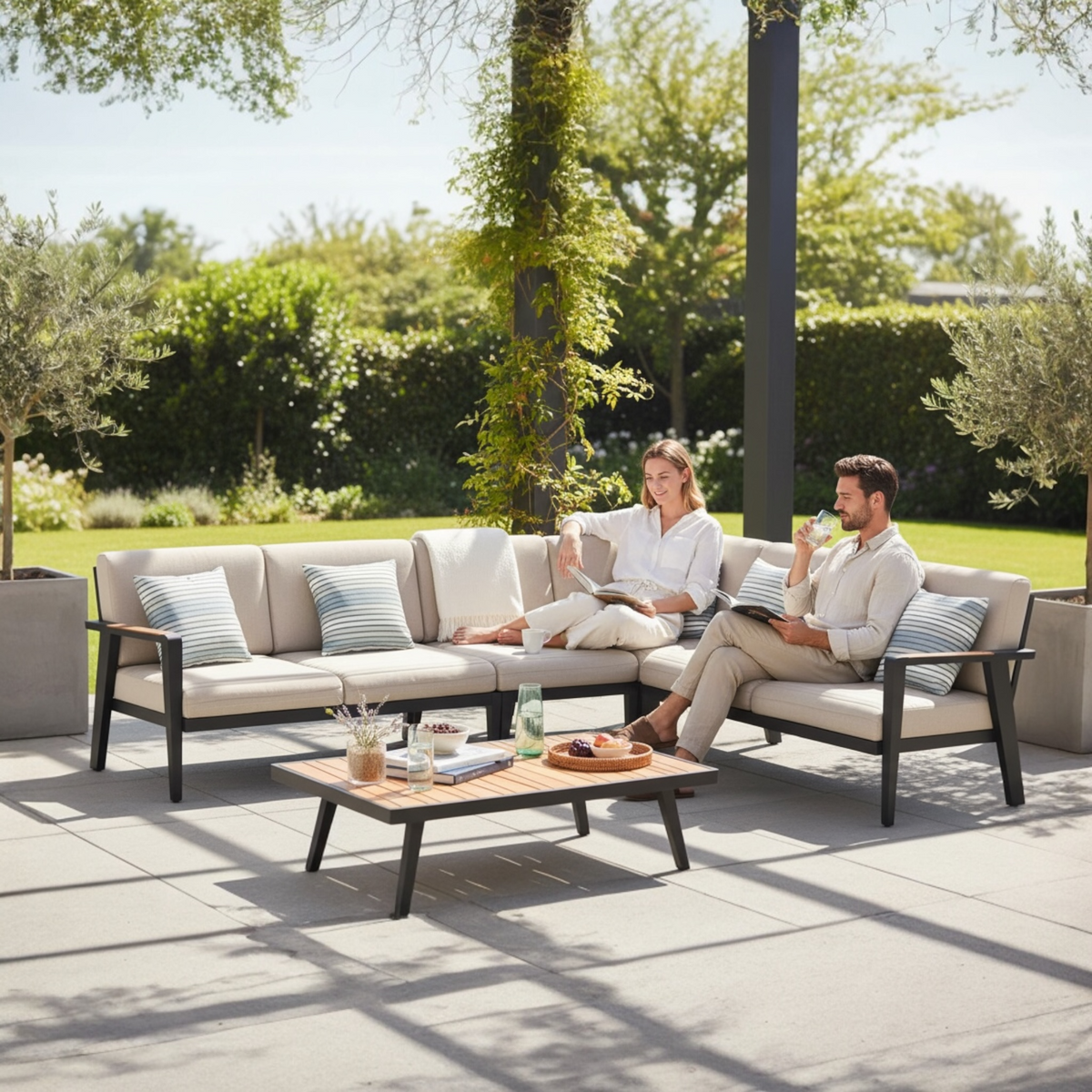 Lovy Cosy black aluminum outdoor sectional with solid teak armrests – shown outdoors (2)