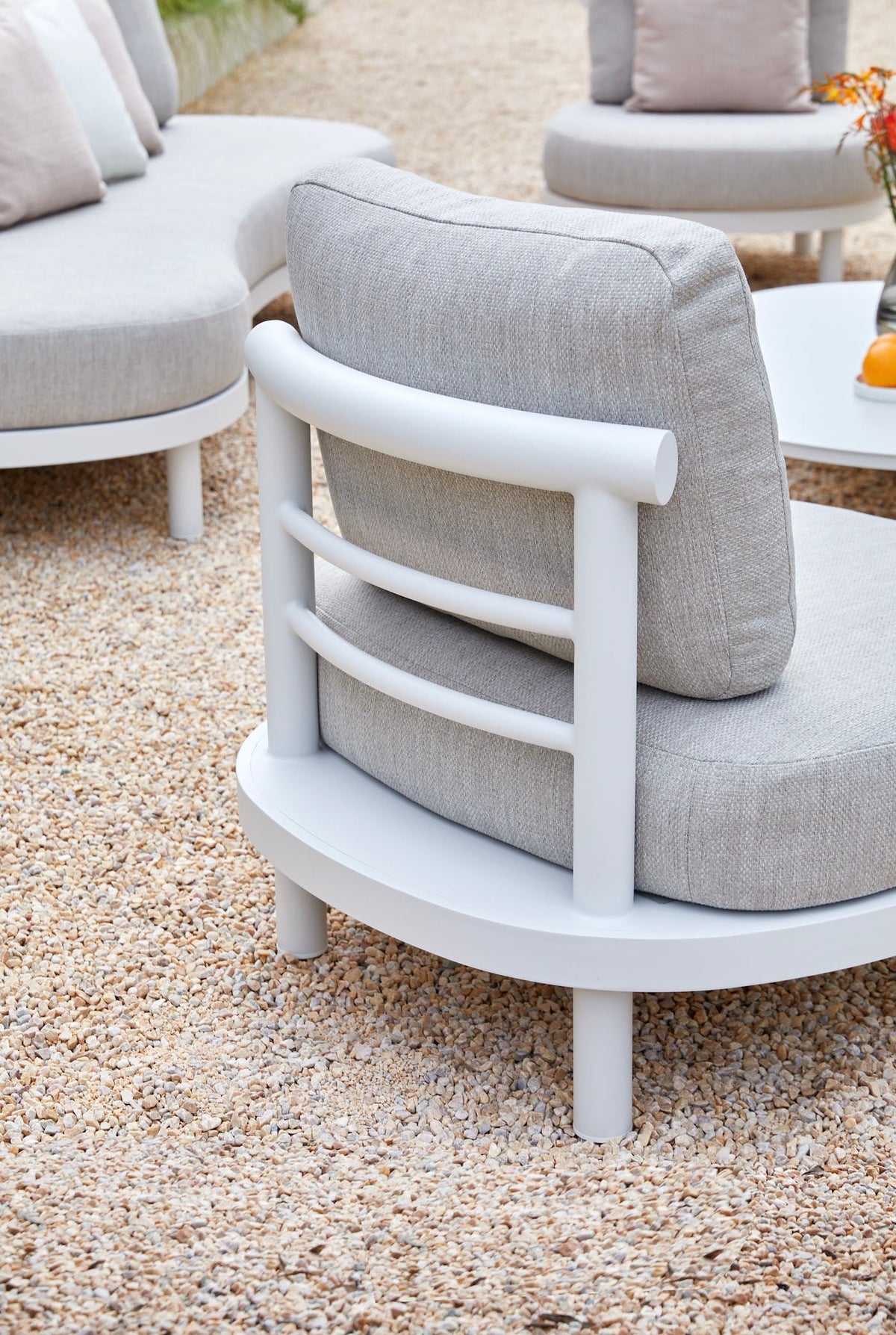 Ambre white aluminum sofa set with light gray cushions – close-up detail
