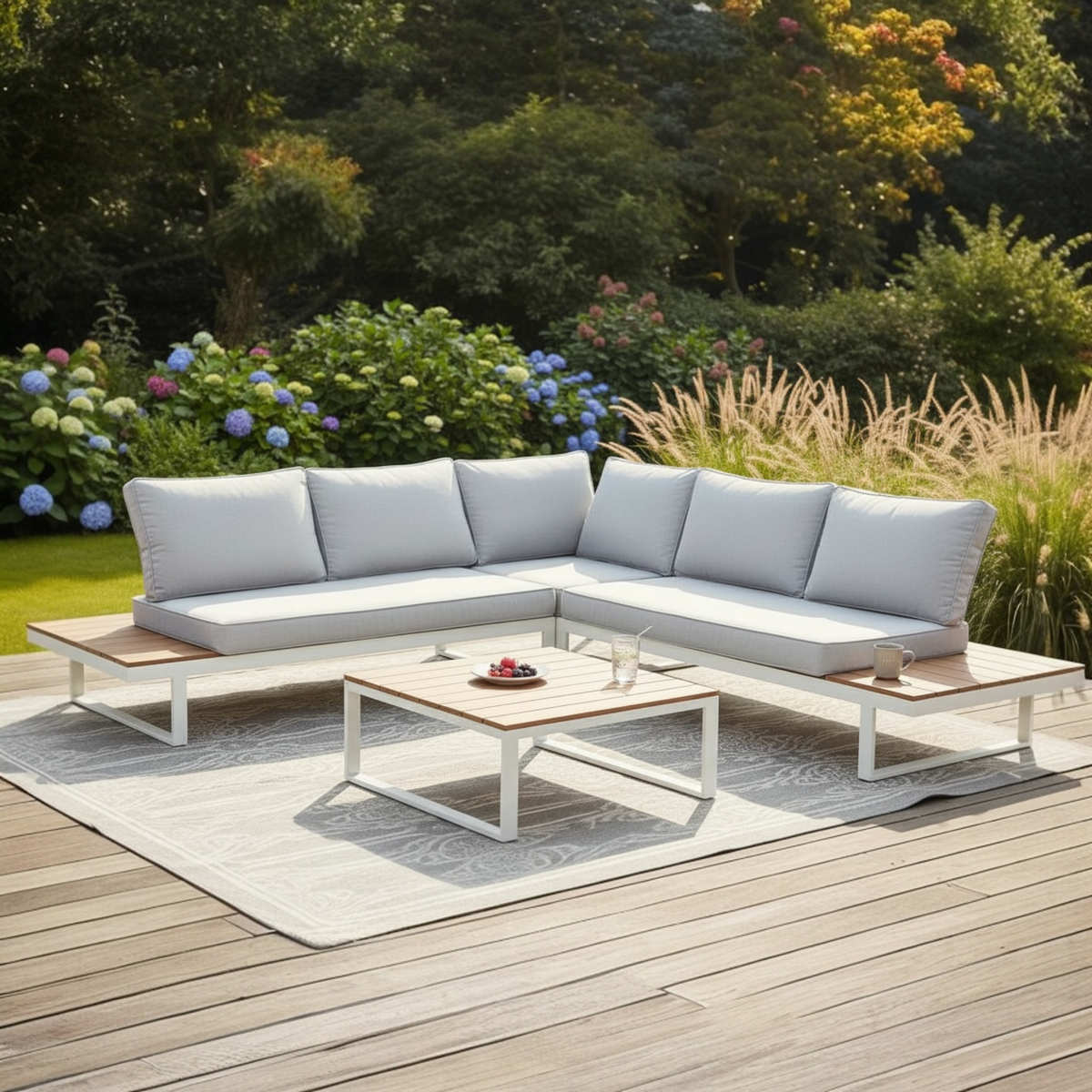 Stacy white aluminum corner outdoor sofa with light gray cushions – shown outdoors (2)