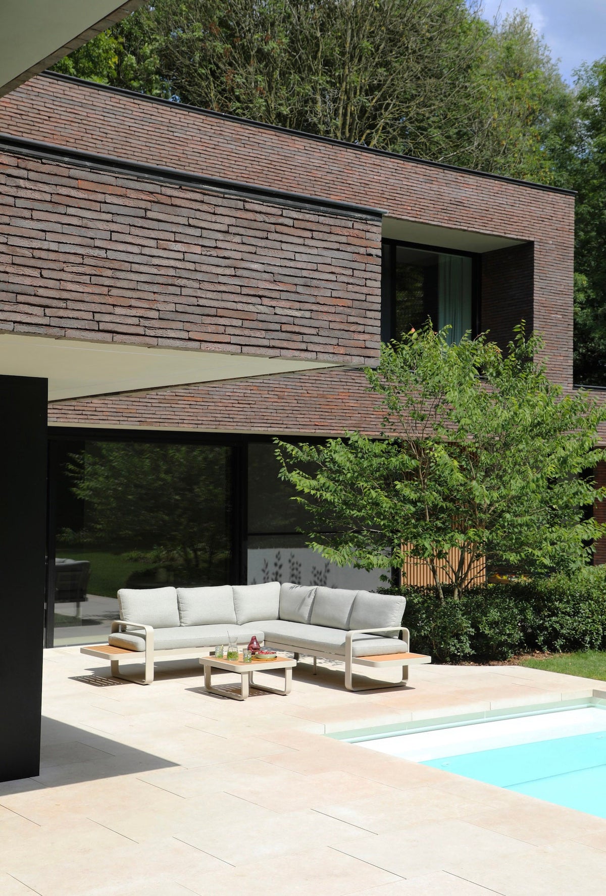Emilia beige aluminum and teak modular outdoor sectional – shown outdoors (3)