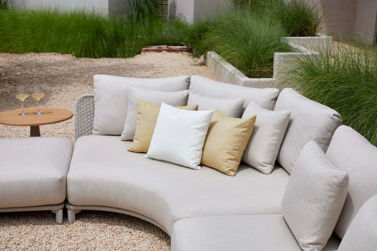 Charly rounded rope outdoor sectional with coffee and side tables – shown outdoors (8)
