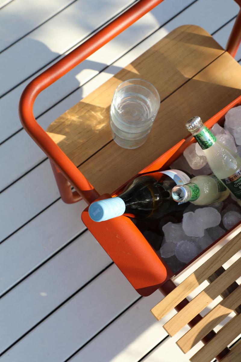 Sunny red aluminum outdoor bar cart with cooler – close-up detail