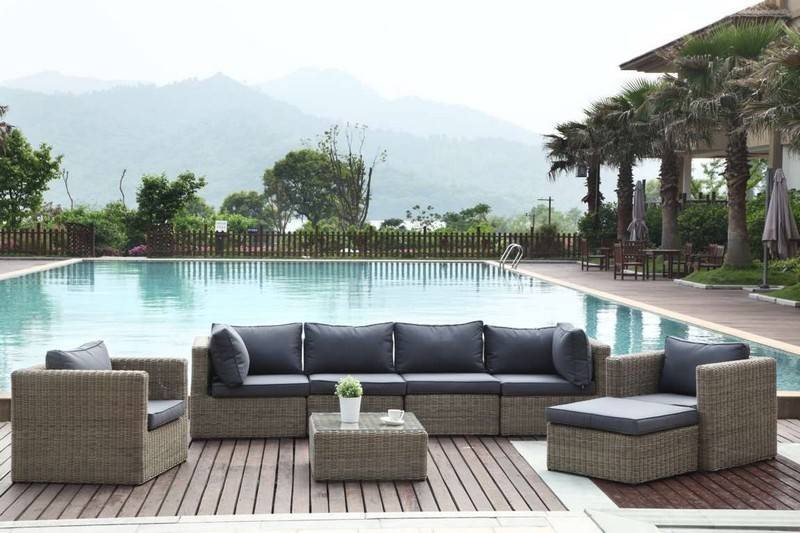 Liberty round resin wicker coffee table with glass top – shown outdoors (3)