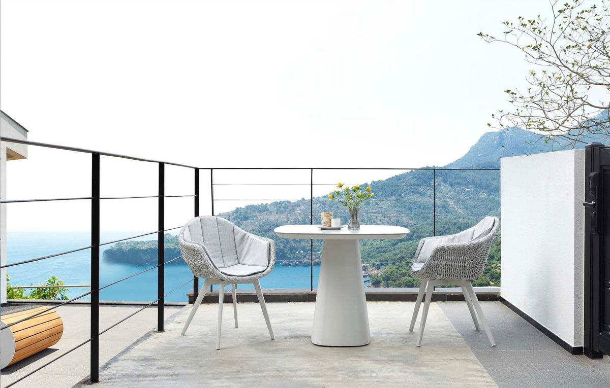 Milo square gray ceramic aluminum outdoor dining table – shown outdoors (3)