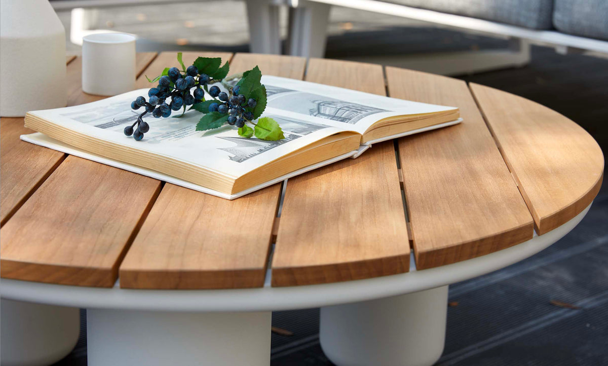 Leo white aluminum patio set with gray olefin cushions and round teak coffee table – close-up detail (2)