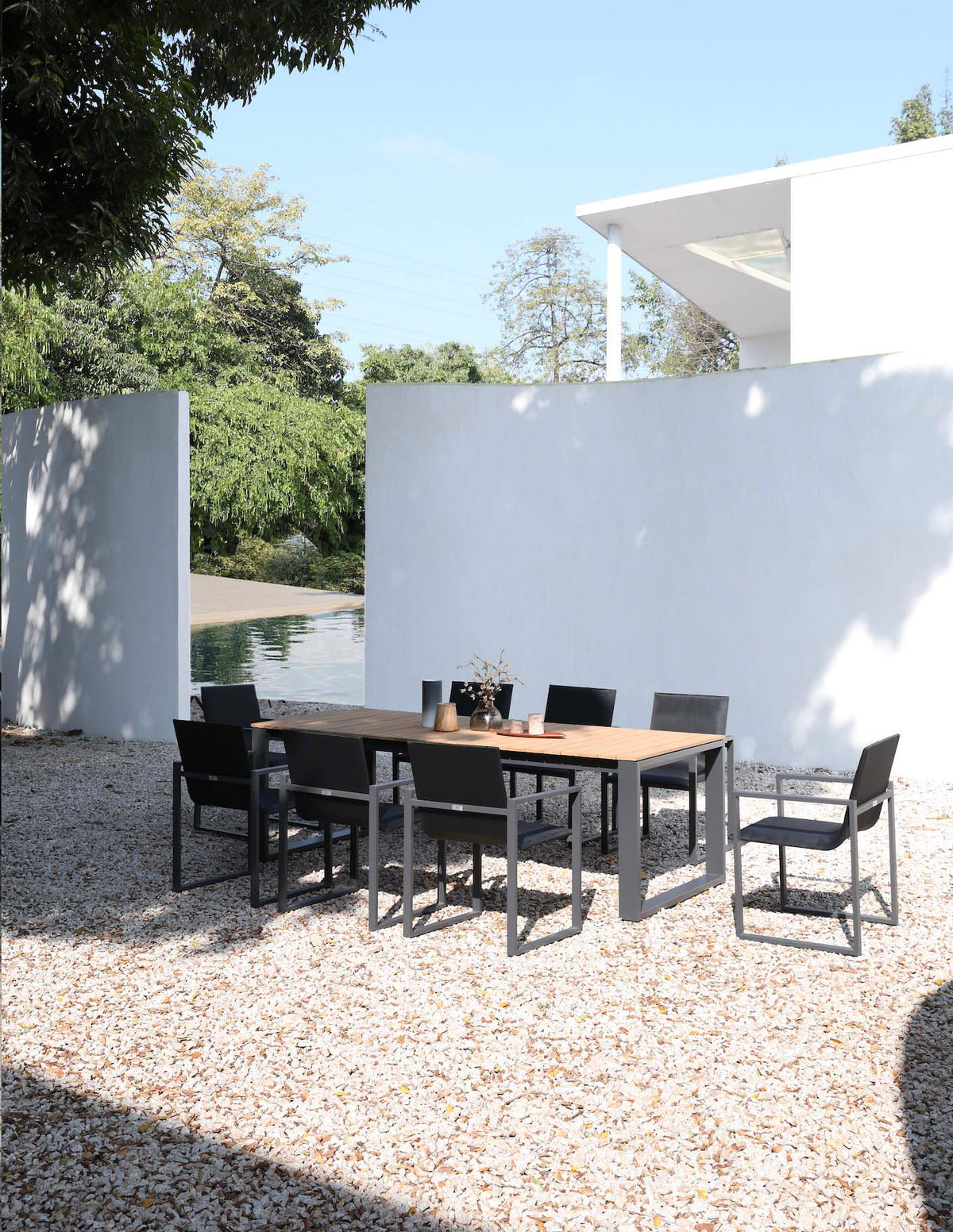 Como black aluminum and teak outdoor dining table, 240 cm – shown outdoors (4)
