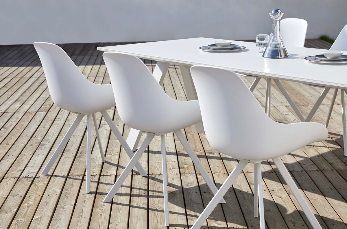Mondo white ceramic outdoor dining table with X legs, 240 cm – shown outdoors (5)