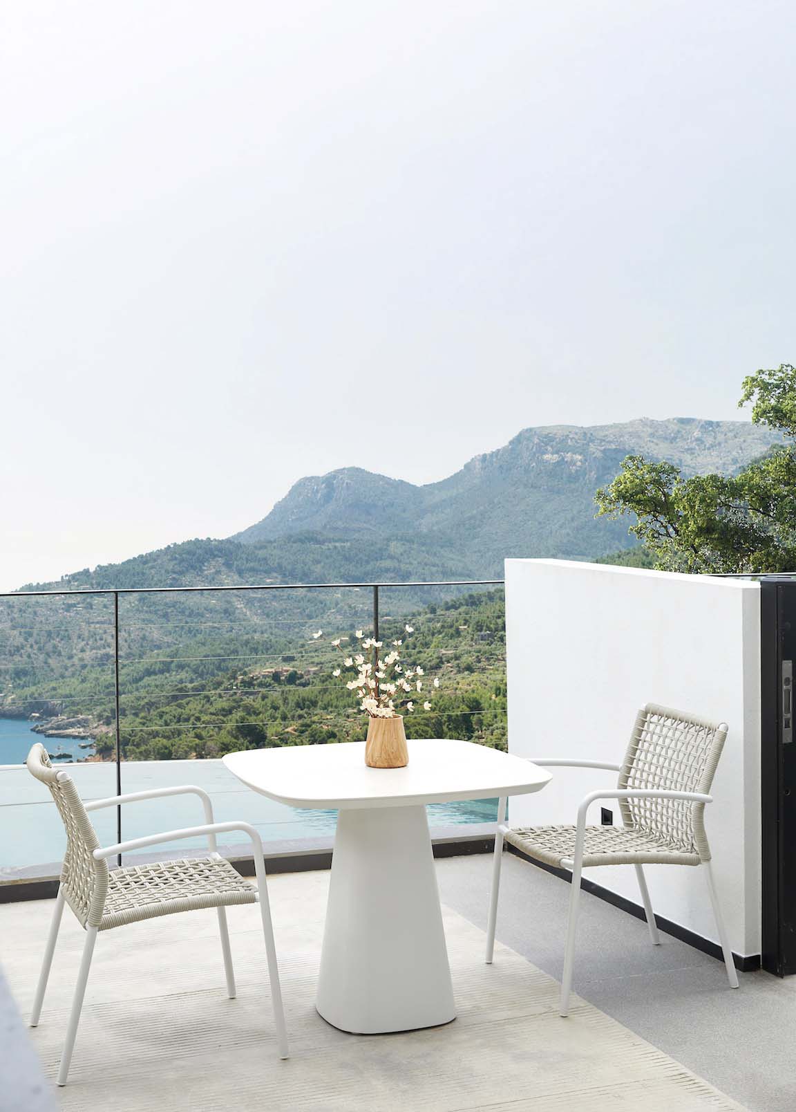 Milo square white ceramic outdoor table with rounded corners – shown outdoors (3)