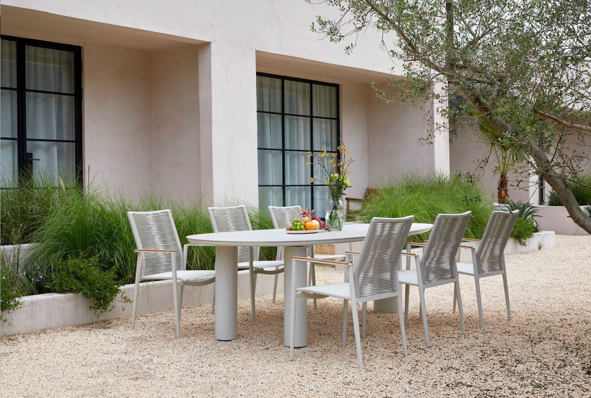 Lyse round ceramic outdoor dining table with three legs – shown outdoors (5)