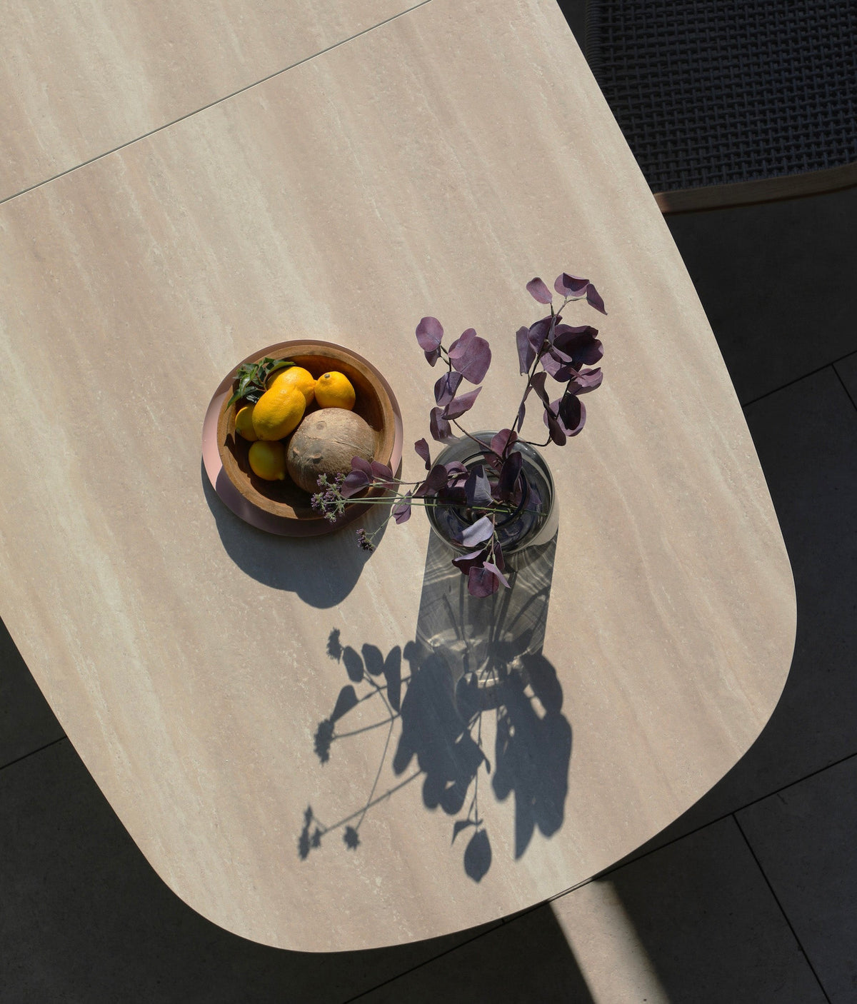 Livio beige oval extendable ceramic outdoor dining table – close-up detail