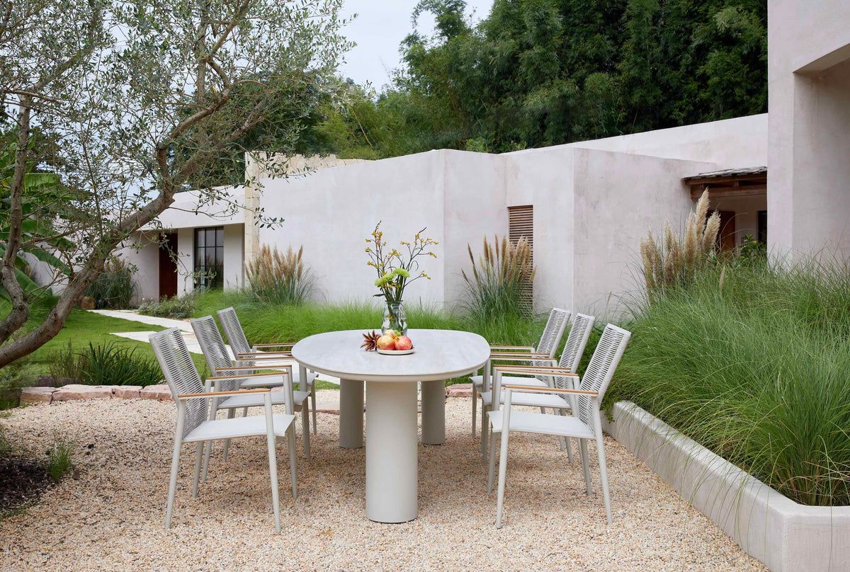 Lyse round ceramic outdoor dining table with three legs – shown outdoors (4)