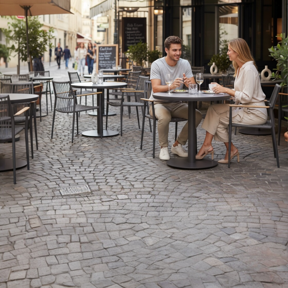 Sarran round ceramic-top terrace table, 90 cm – shown outdoors