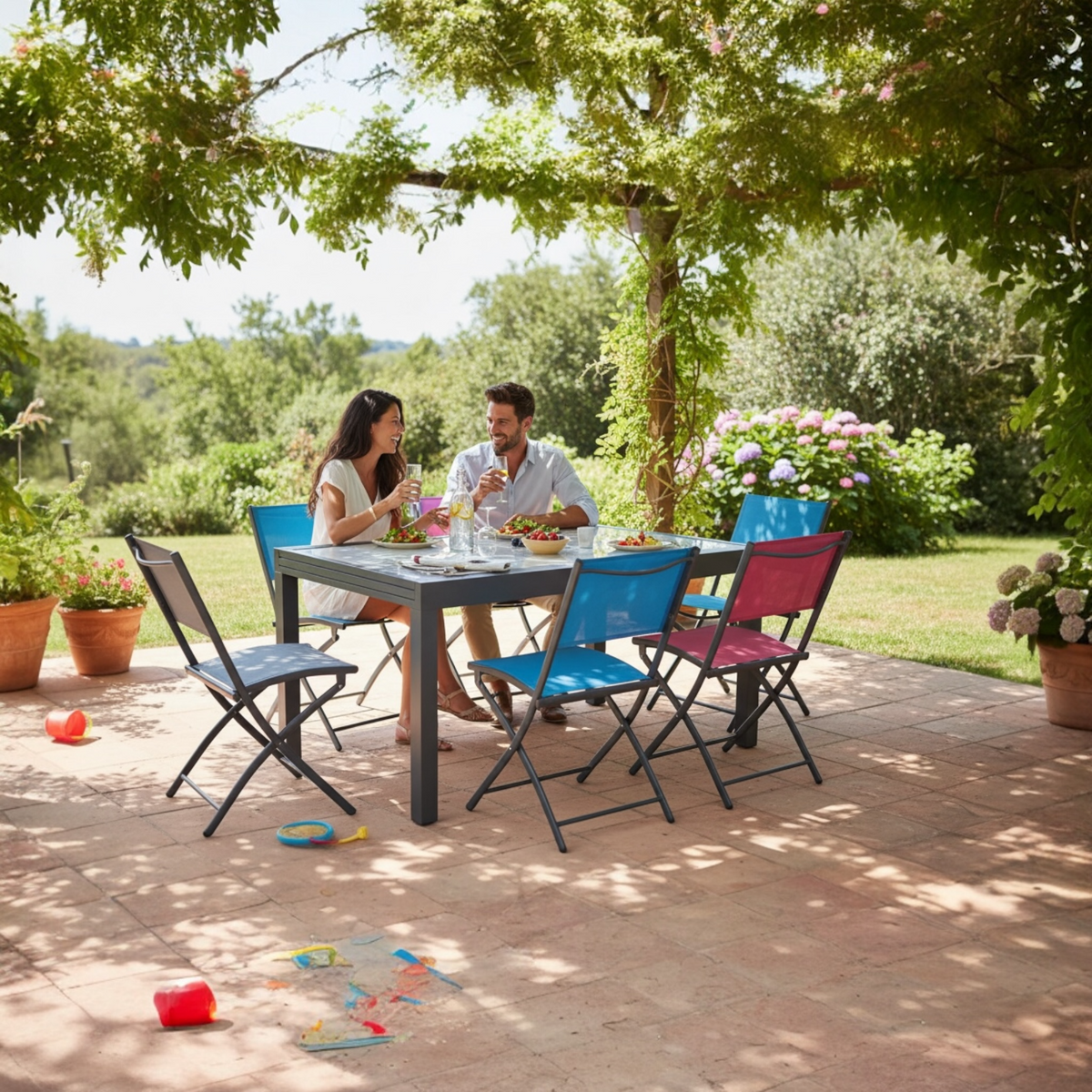 Fancy extendable aluminum table with smoked gray glass top – shown outdoors (2)