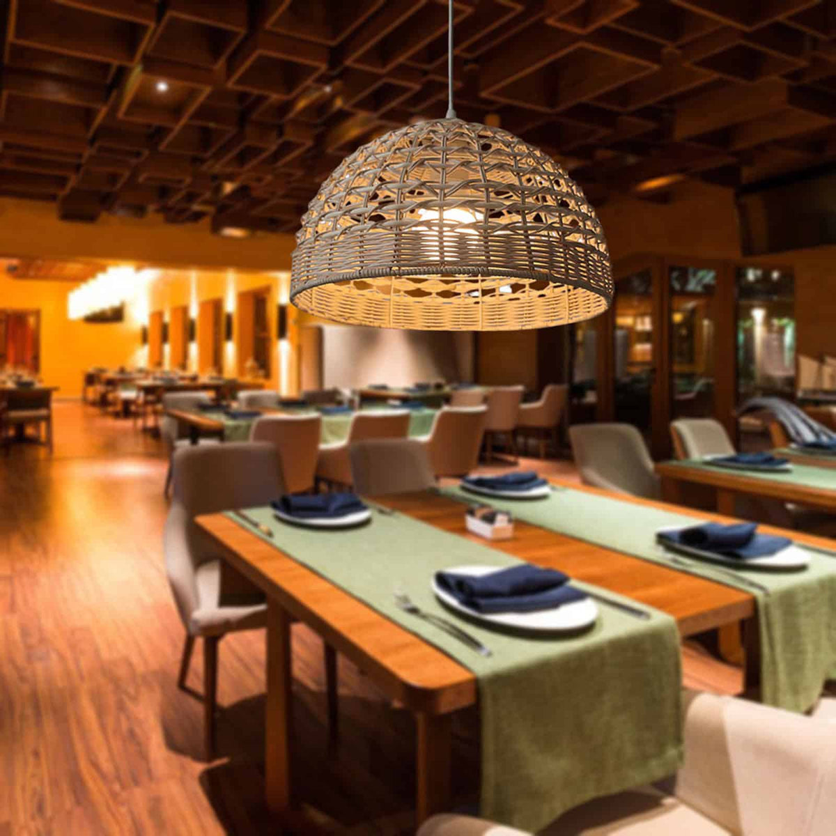 Ovoid handwoven rattan and wicker pendant shade – shown lit in a room setting (3)