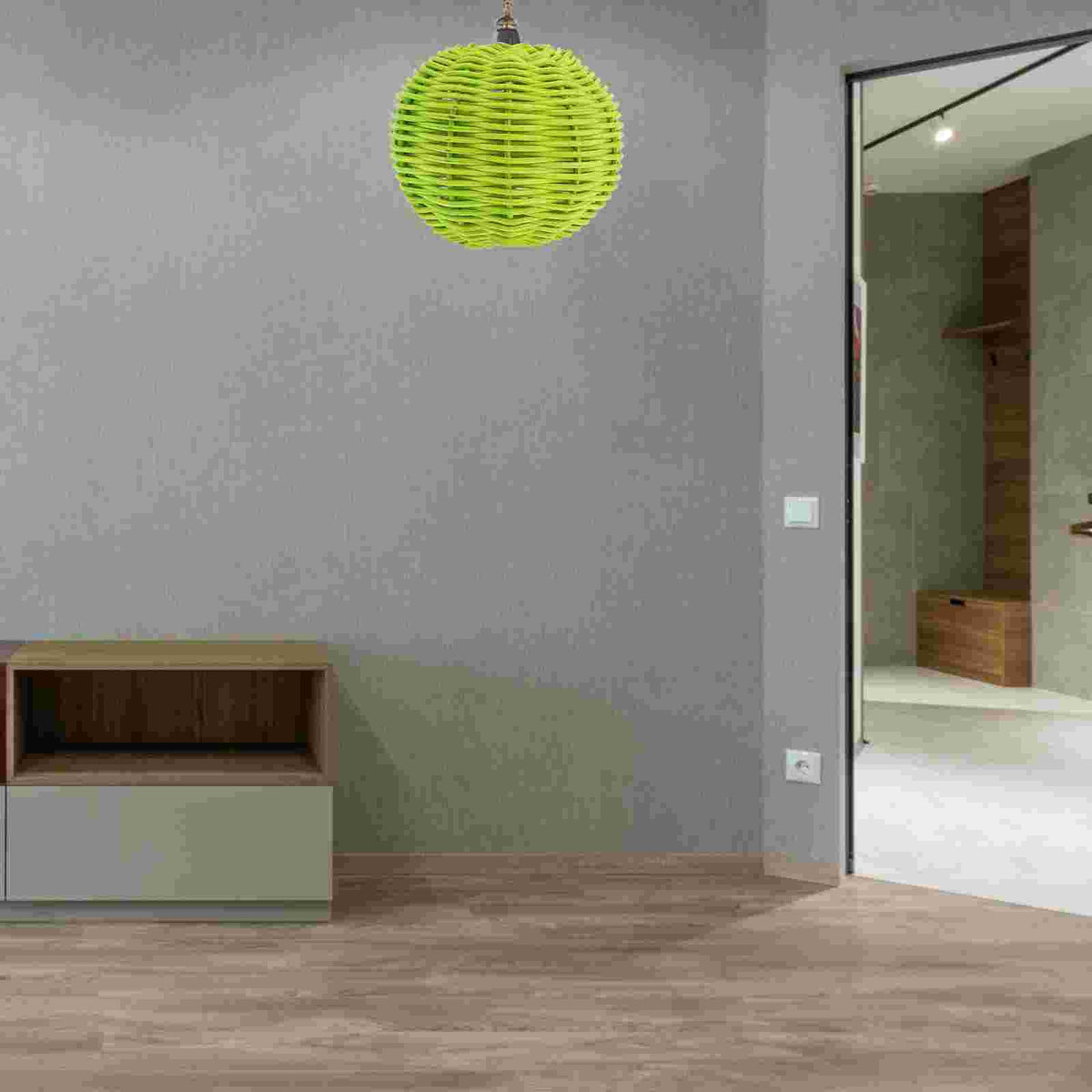 Clip-on rattan lamp shade with a wicker clip – green version, shown in a room setting (2)