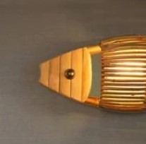 Handwoven natural rattan fish-shaped wall sconce – close-up detail
