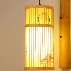 Cylindrical rattan wall sconce with an Asian-inspired woven pattern – close-up detail, lit