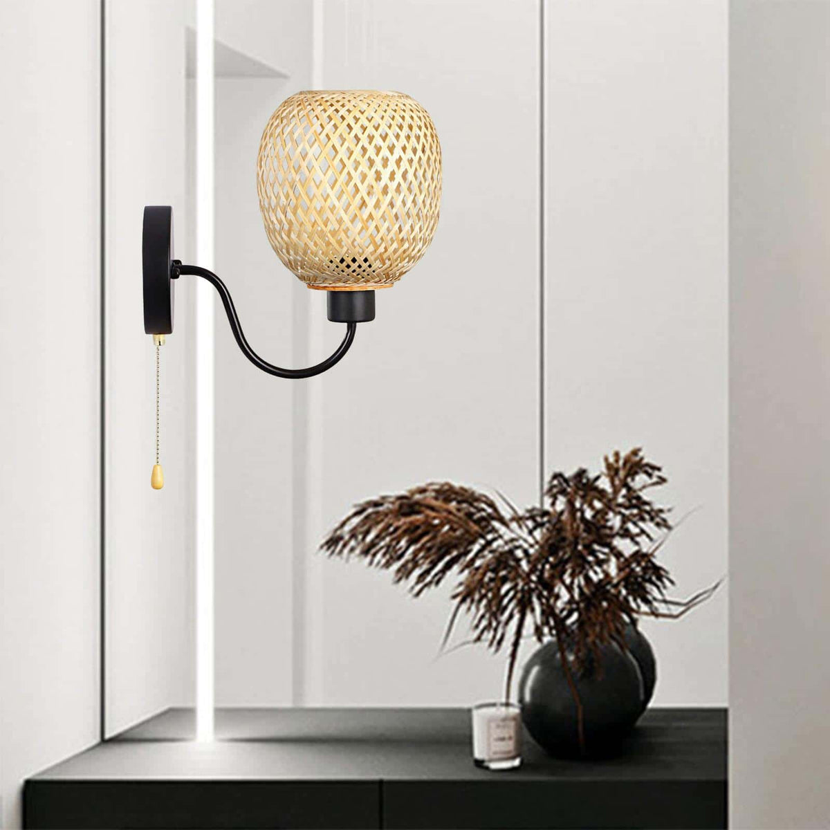 Retro wall sconce with a handwoven bamboo shade and matte black iron arm – shown lit in a room setting