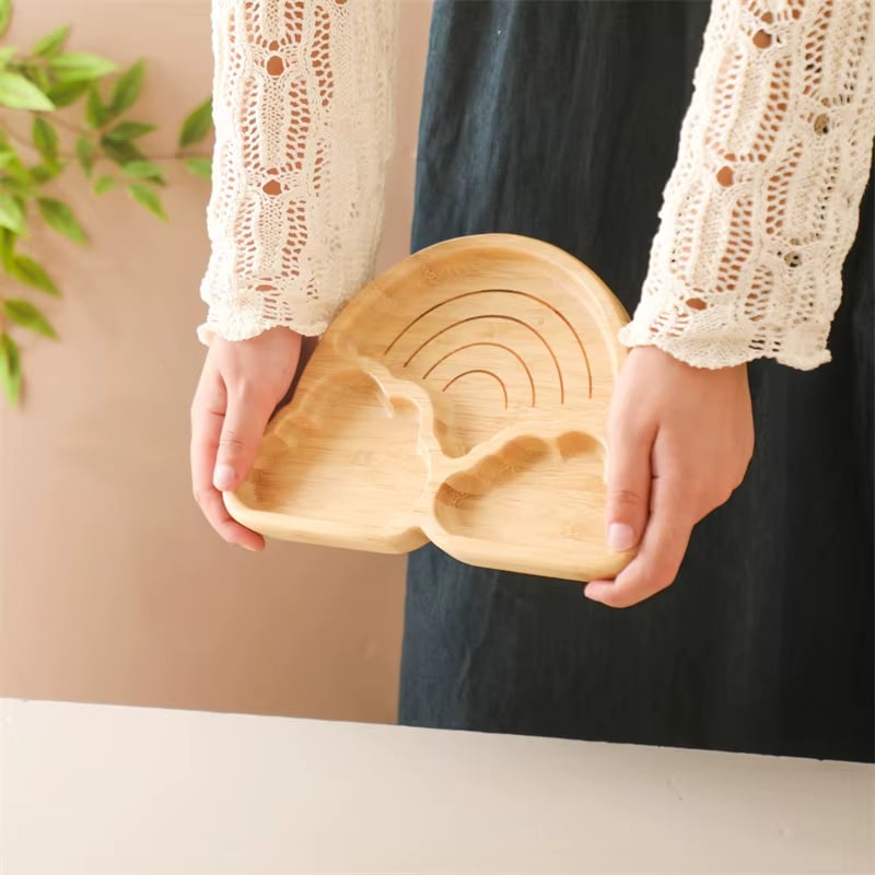 Bamboo baby plate with a silicone suction base – shown in use