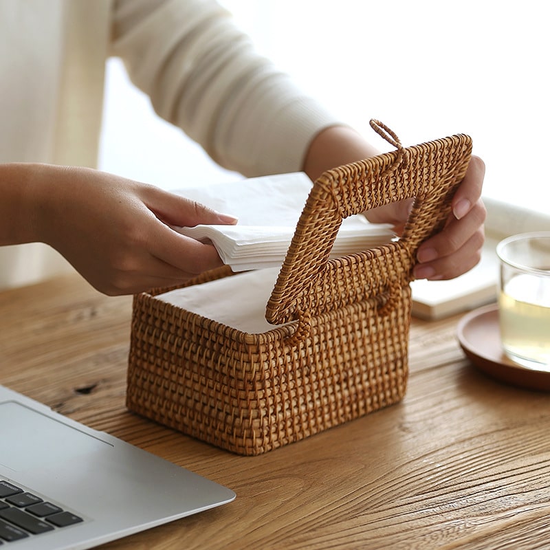 Handwoven bamboo tissue box in beige and warm brown – shown in use (2)
