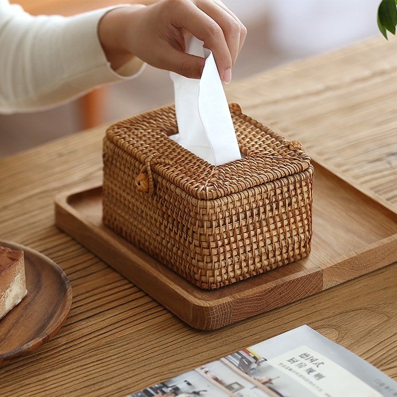 Handwoven bamboo tissue box in beige and warm brown – shown in use