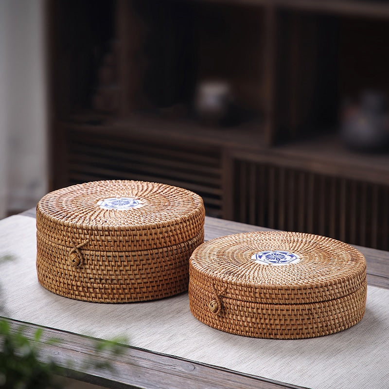Handwoven rattan box with an Andalusian-style hand-painted ceramic lid – shown in a room setting