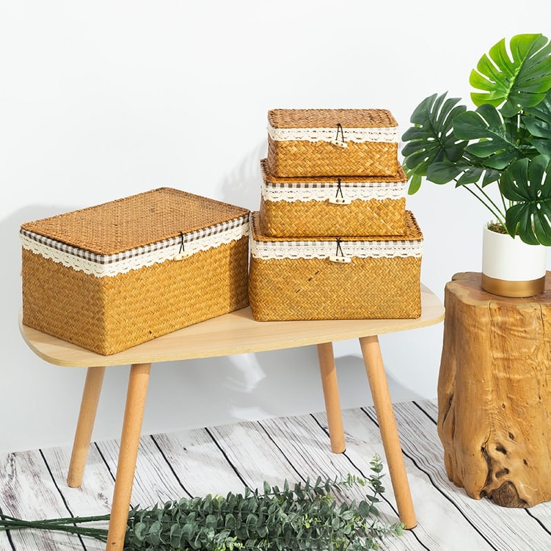 Woven natural rattan trunk-style storage box with a lid – shown in a room setting